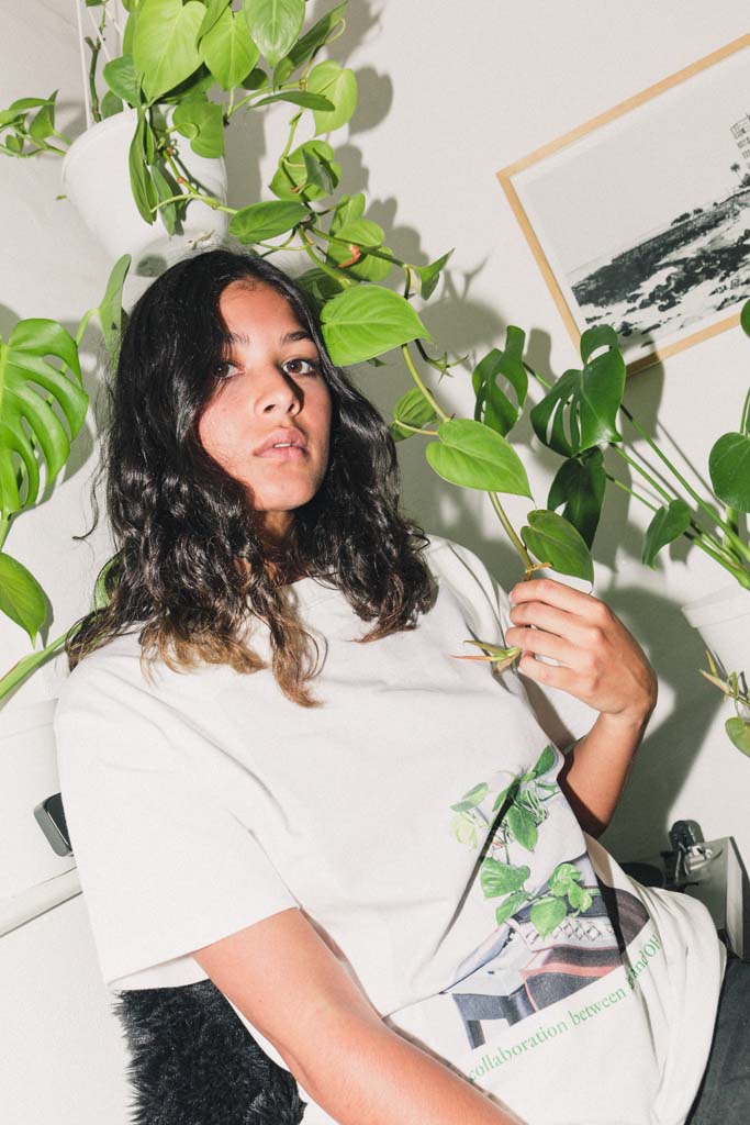 Girl surrounded by plants